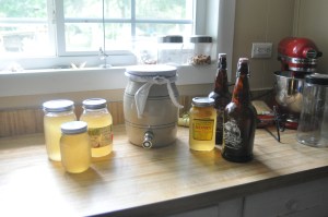 The ceramic container with the spigot is where the kombucha ferments with the SCOBY. It needs to be room temperature and away from direct sunlight.