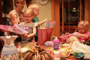 The kids each had a gift bag to open. They received new placemats, watercolors and crackerjacks!